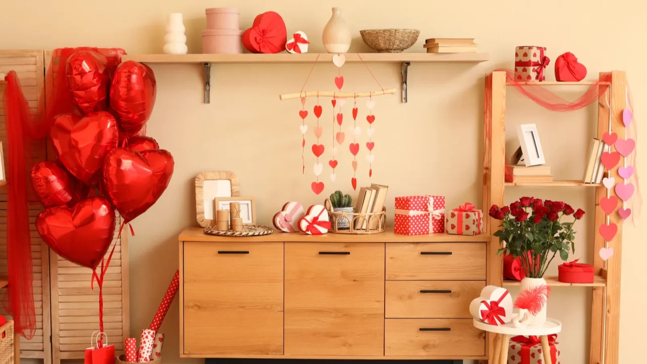 interior of festive room with hearts balloons roses and gift