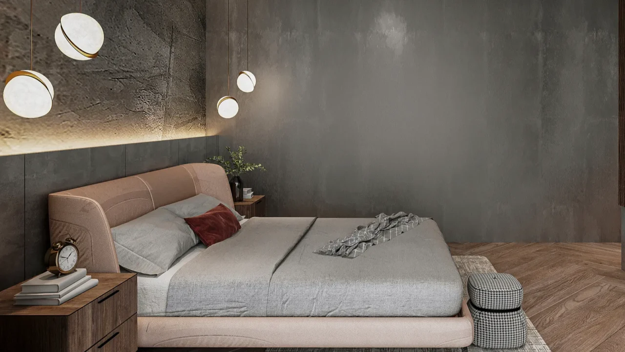 A stylish bedroom with a pink upholstered bed and artistic light fixtures.