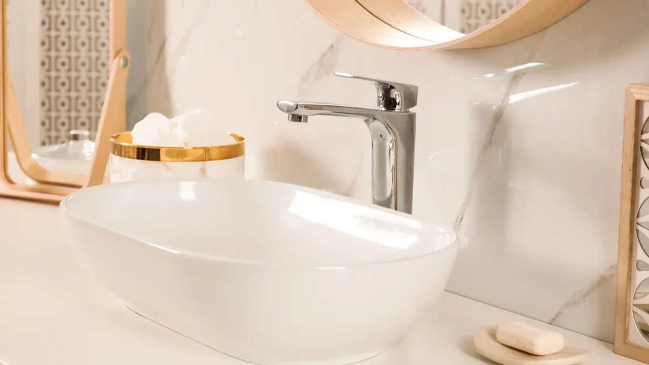 stylish bathroom interior with vessel sink and decor elements