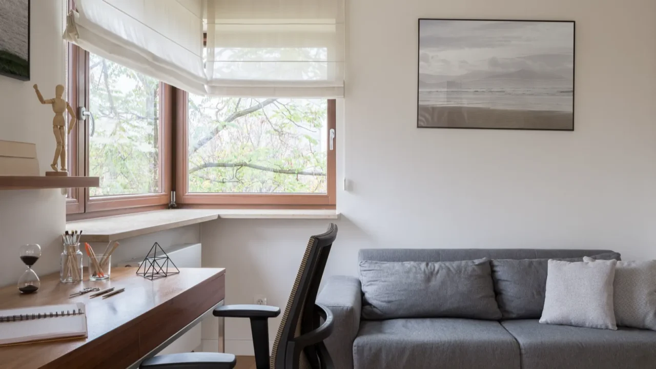 stylish home office room with window gray couch and wooden