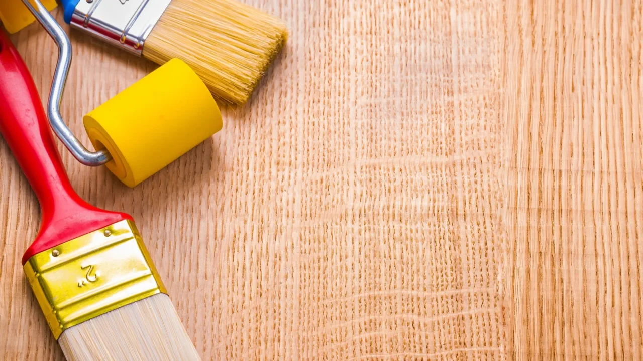 two paint brushes and roller