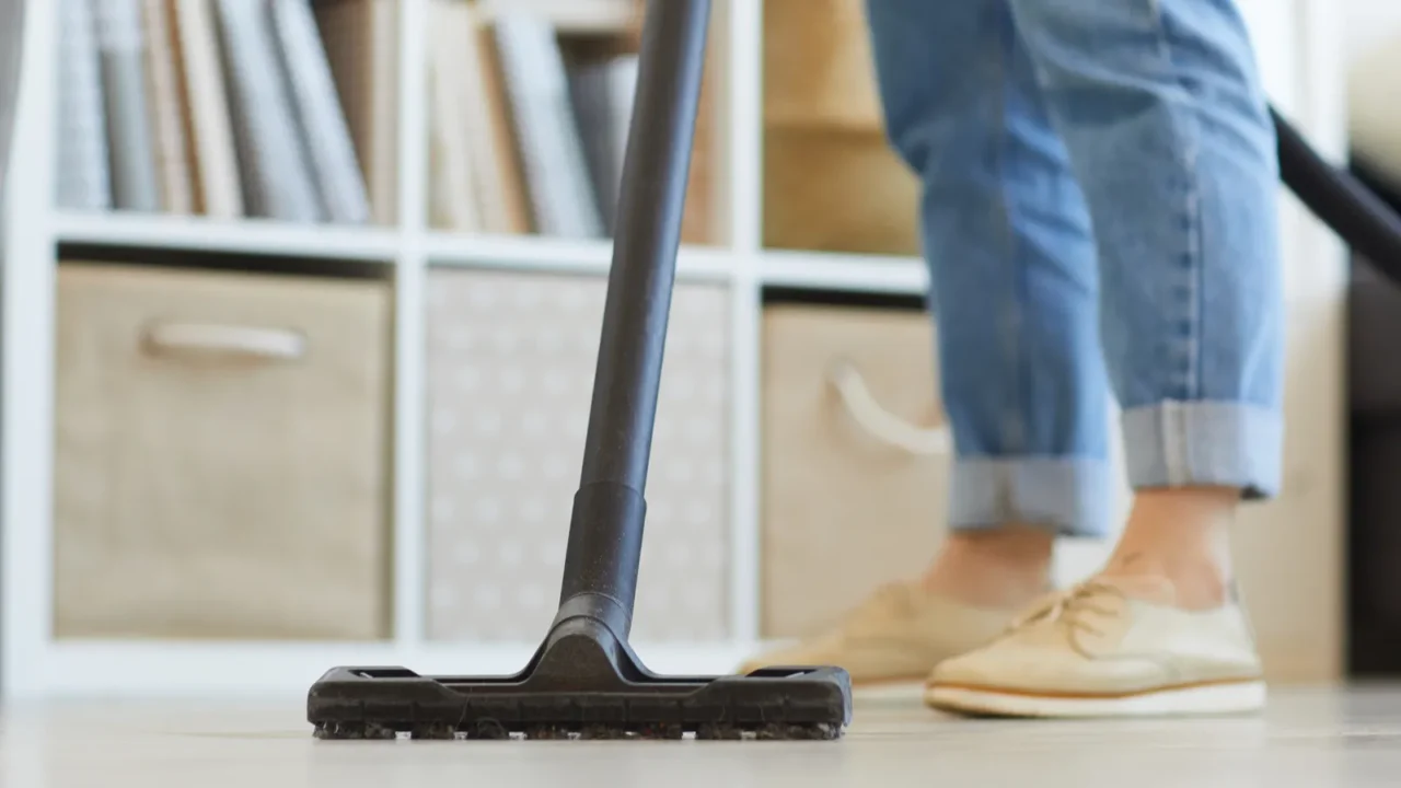 woman vacuuming at home