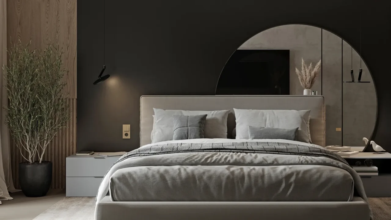 A modern bedroom with a cozy bed, a plant pot, a rug, and a custom-cut mirror placed behind the bed on a black wall.