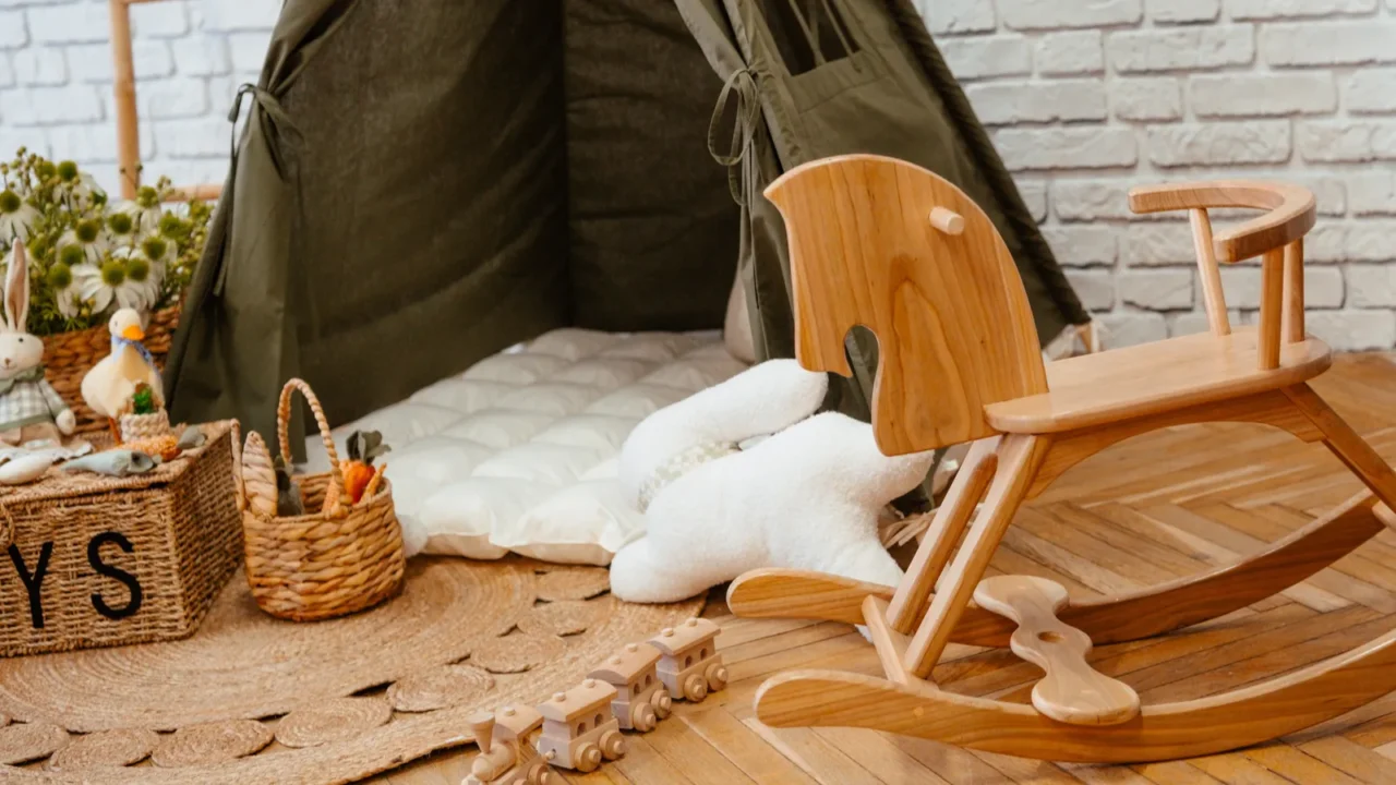 a wooden rocking horse is positioned next to a kids