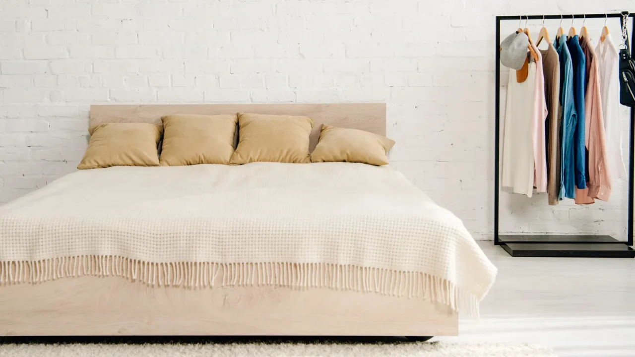 big bed with cushions and blanket in teenage bedroom