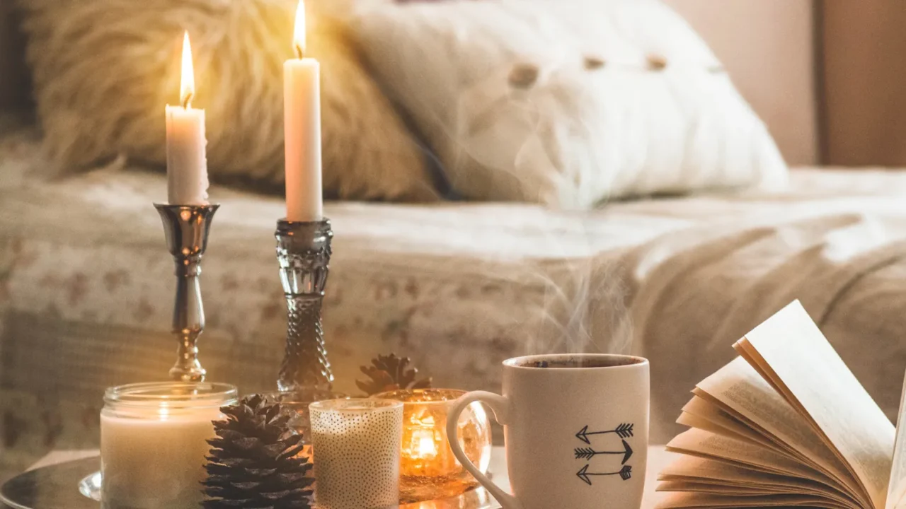 book cup of coffee and many candles on the home