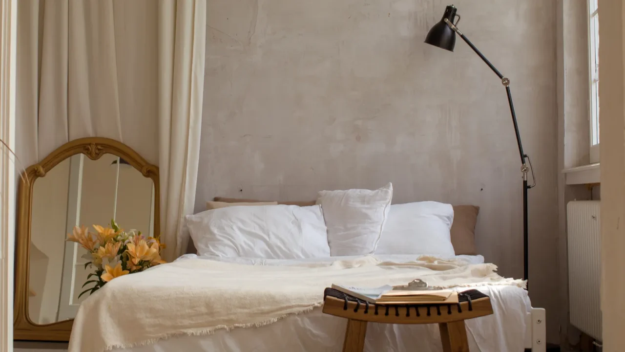 bright bedroom with empty bed copy space