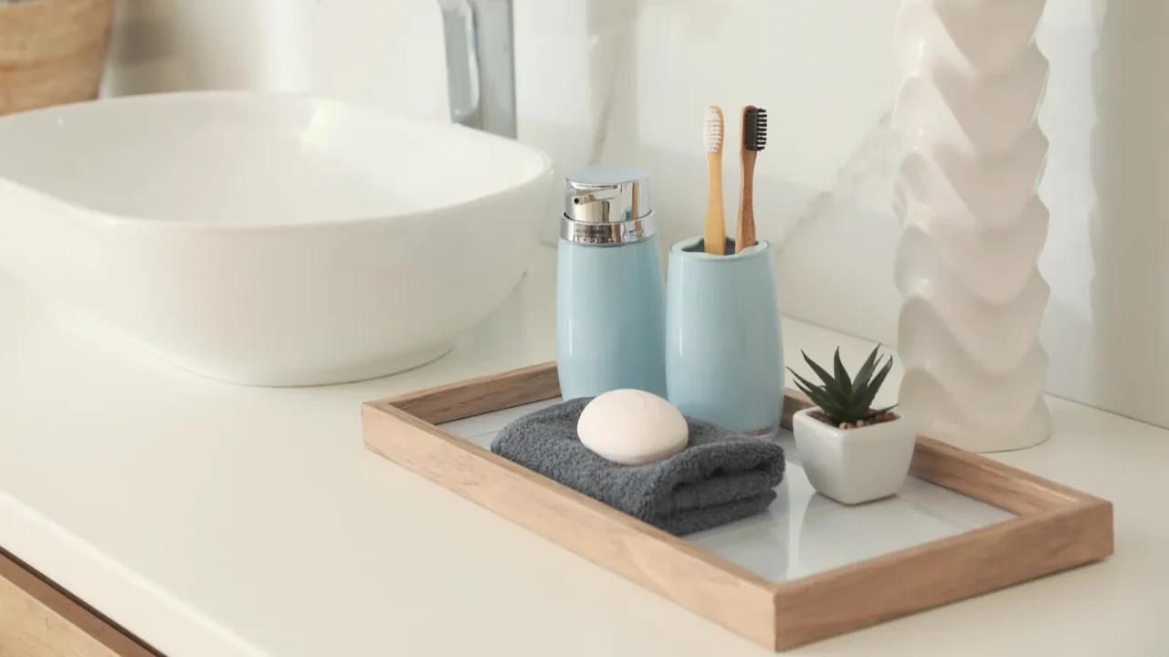 countertop with sink and toiletries in bathroom interior design