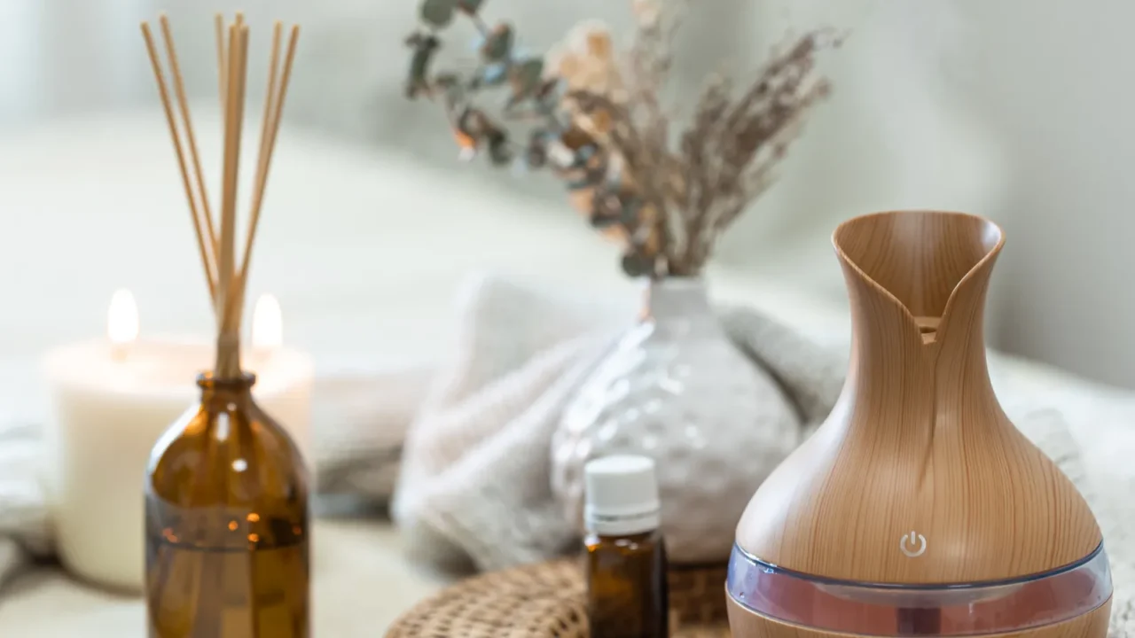 cozy spa composition with aroma oil diffuser lamp on a