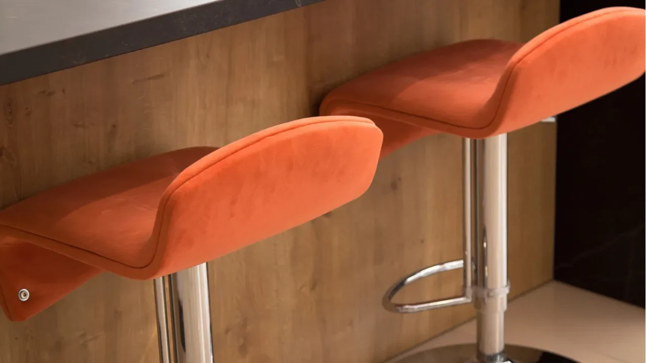 interior of modern kitchen and walnut cabinets orange chair