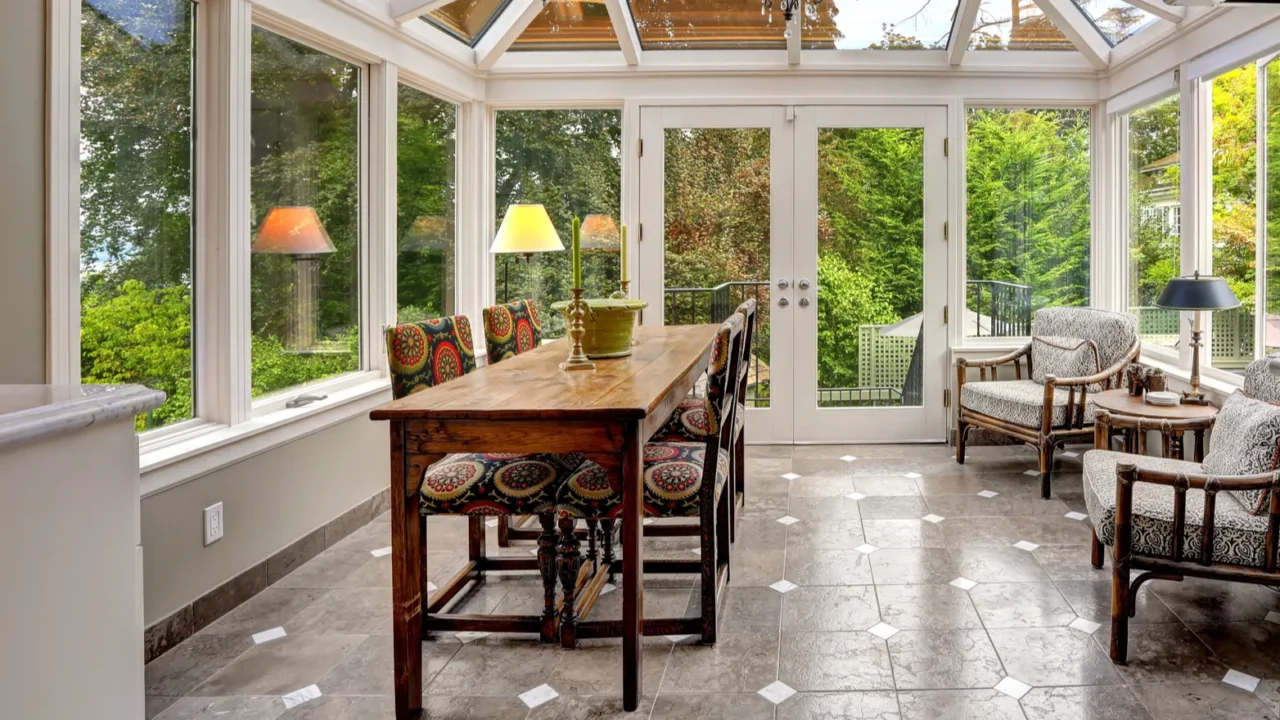 sunroom patio area with transparent vaulted ceiling