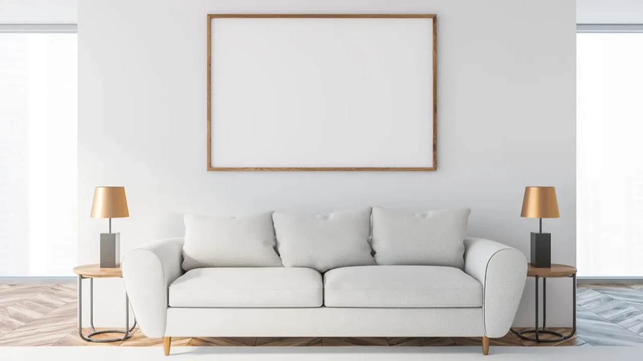 white living room with white sofa and poster