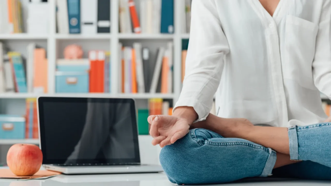 woman practicing meditation at home
