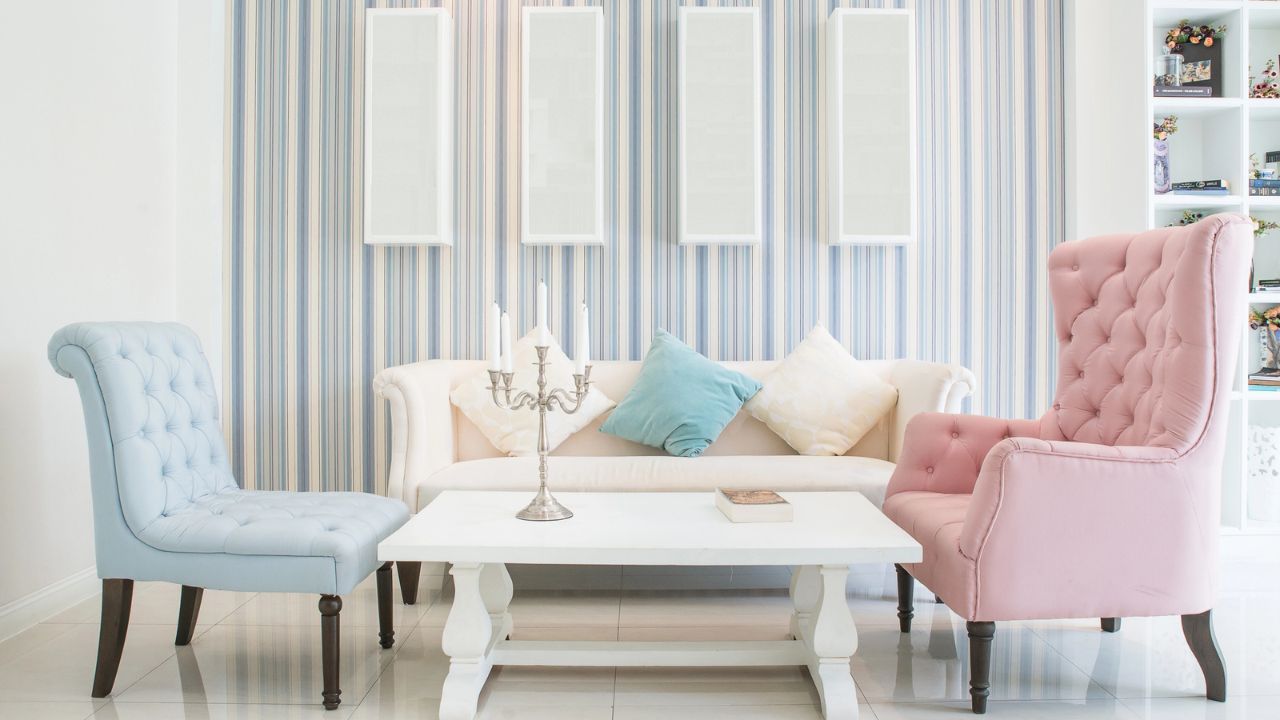 A stylish living room with colorful chairs and elegant decor.