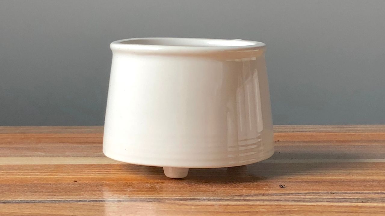 A small white ceramic container.
