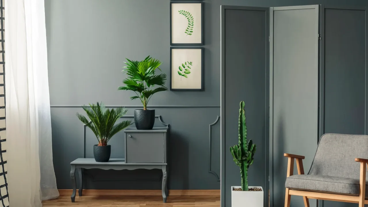 a chair standing in front of a decorative grey screen