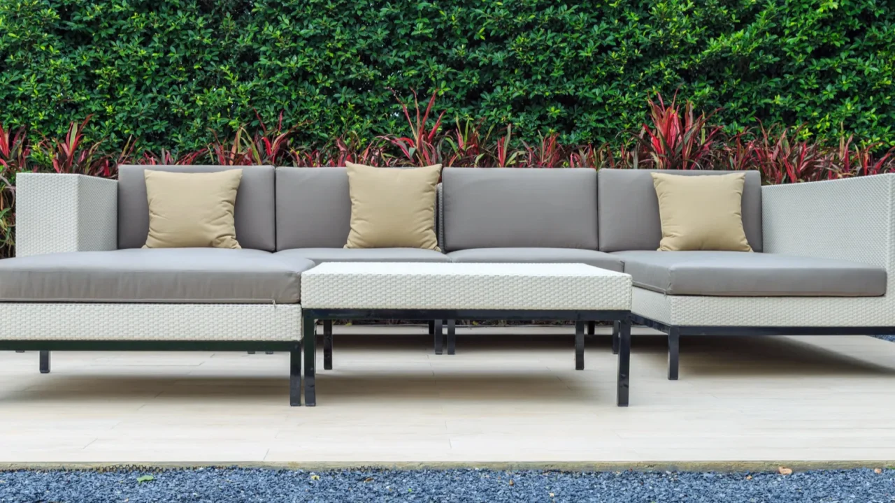 a three brown pillow and gray cushion on a modern