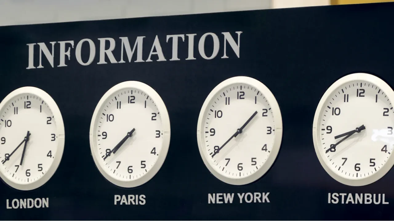 airport information desk with time zone clocks