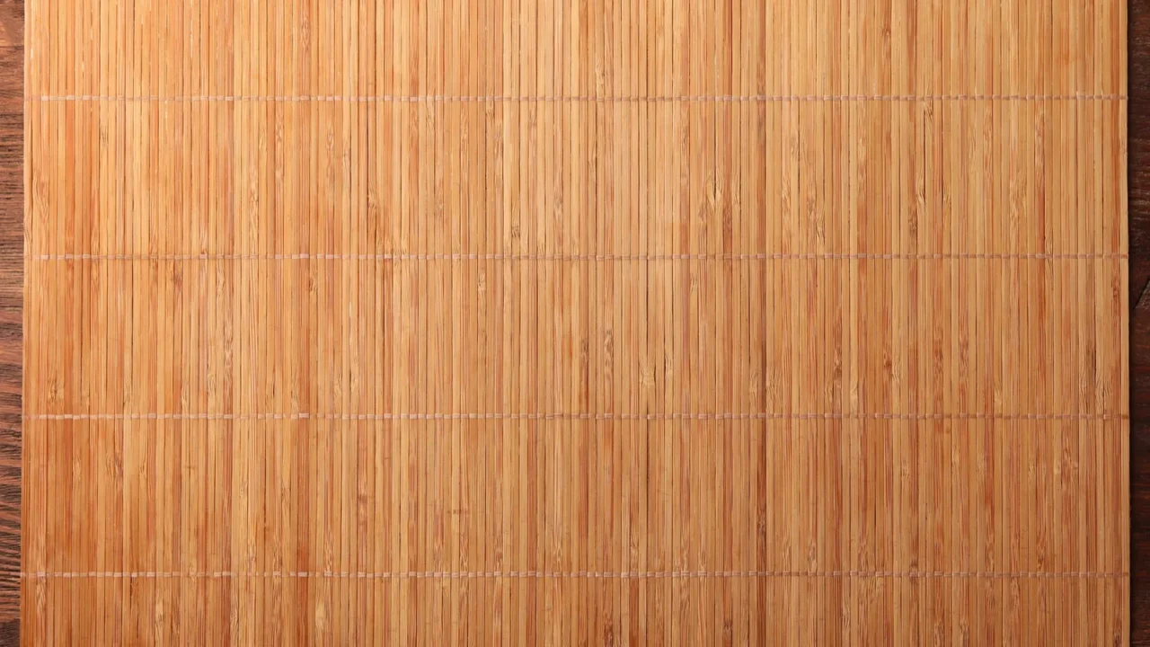 bamboo mat on wooden table top view space for text