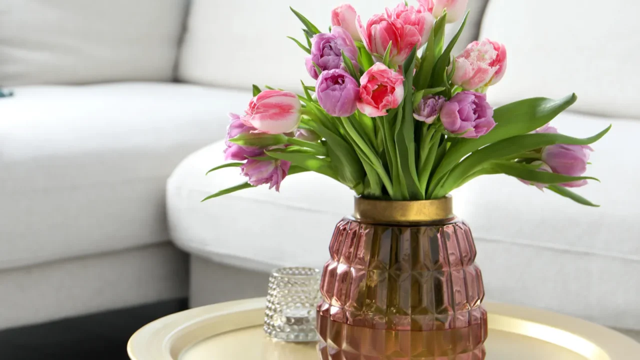 beautiful bouquet of colorful tulip flowers on coffee table in