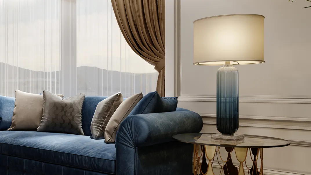 blue designer fabric sofa in front of the window with
