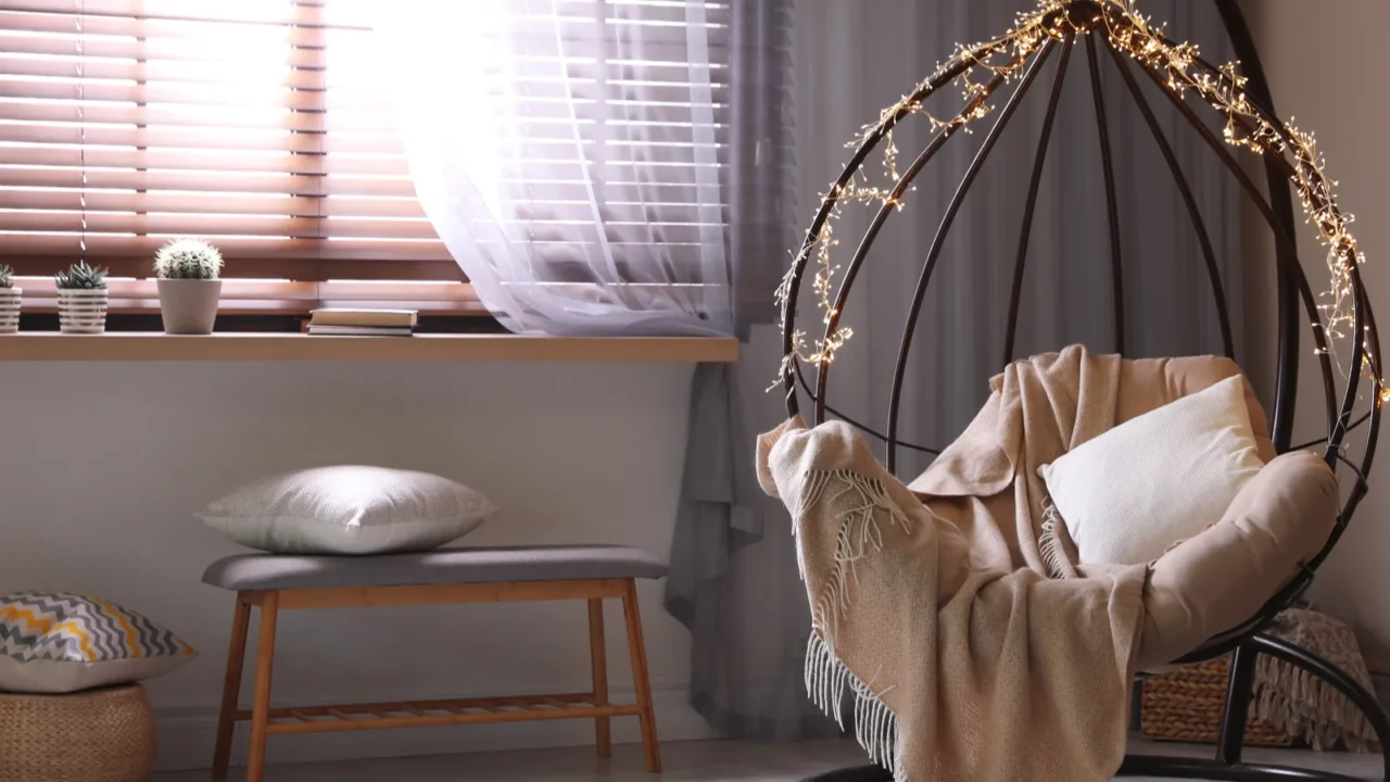 cozy hanging chair with fairy lights in modern living room