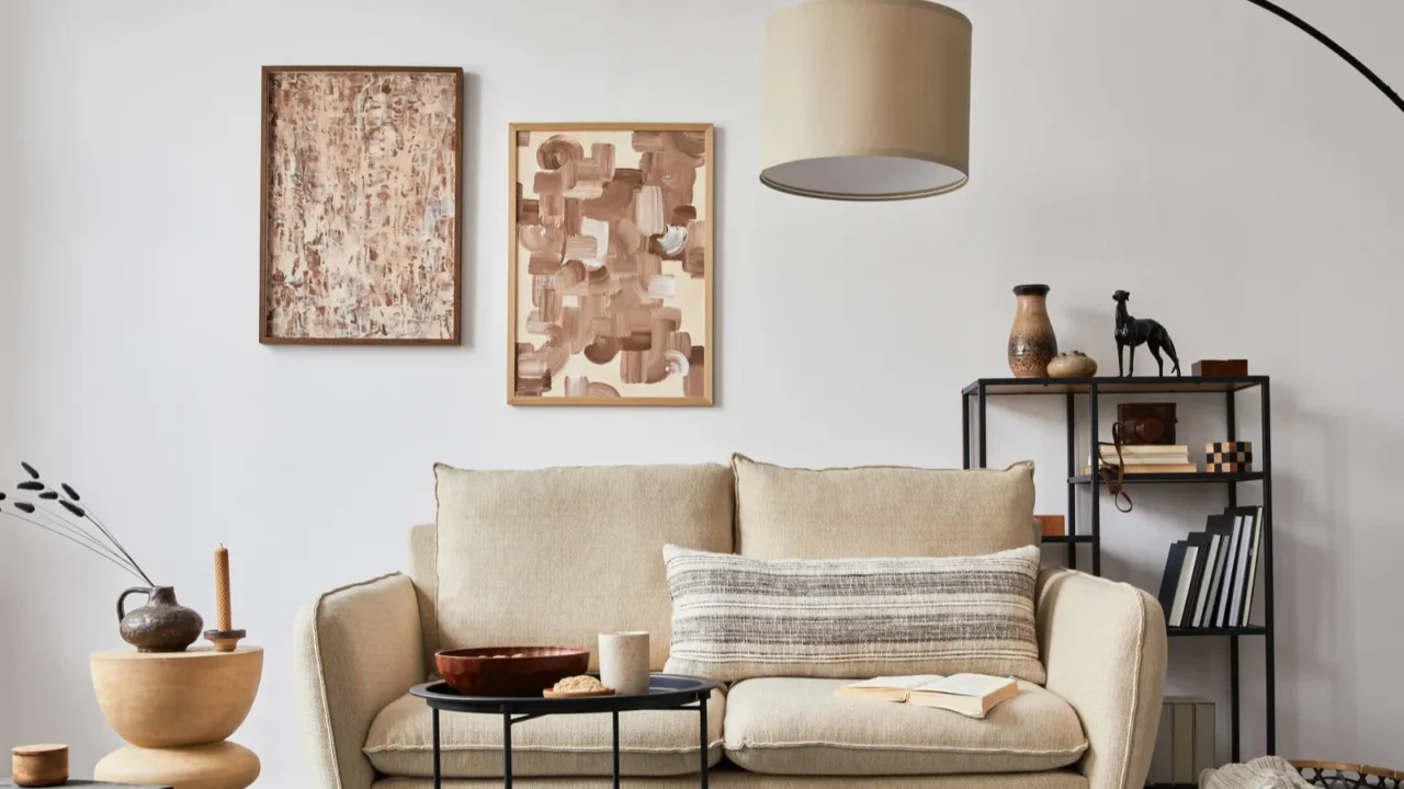 creative composition of modern living room interior with beige sofa, wall art and floor lamp.