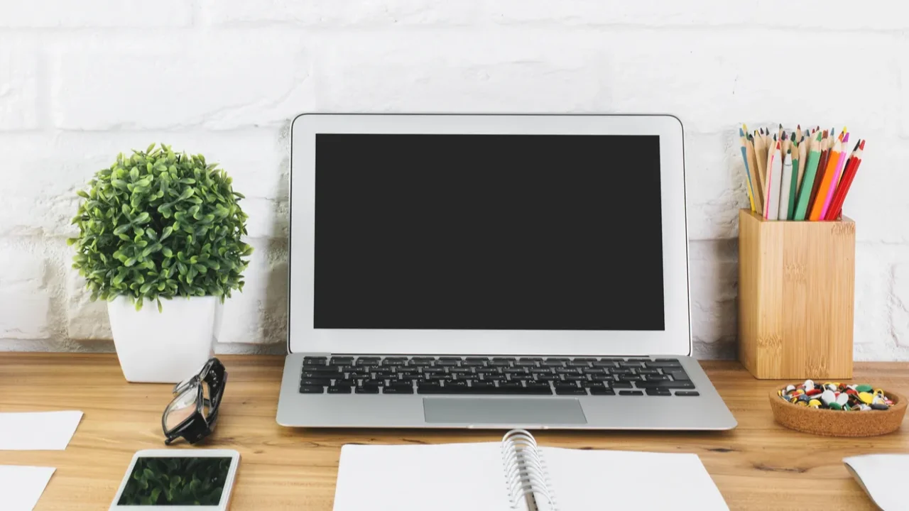 creative designer table with empty laptop