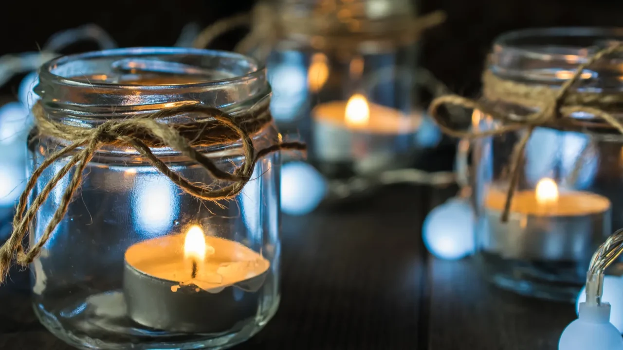 decorative composition with mason jar candles and lights