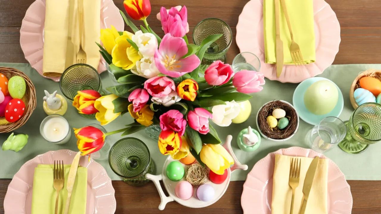 festive easter table setting with beautiful flowers and painted eggs