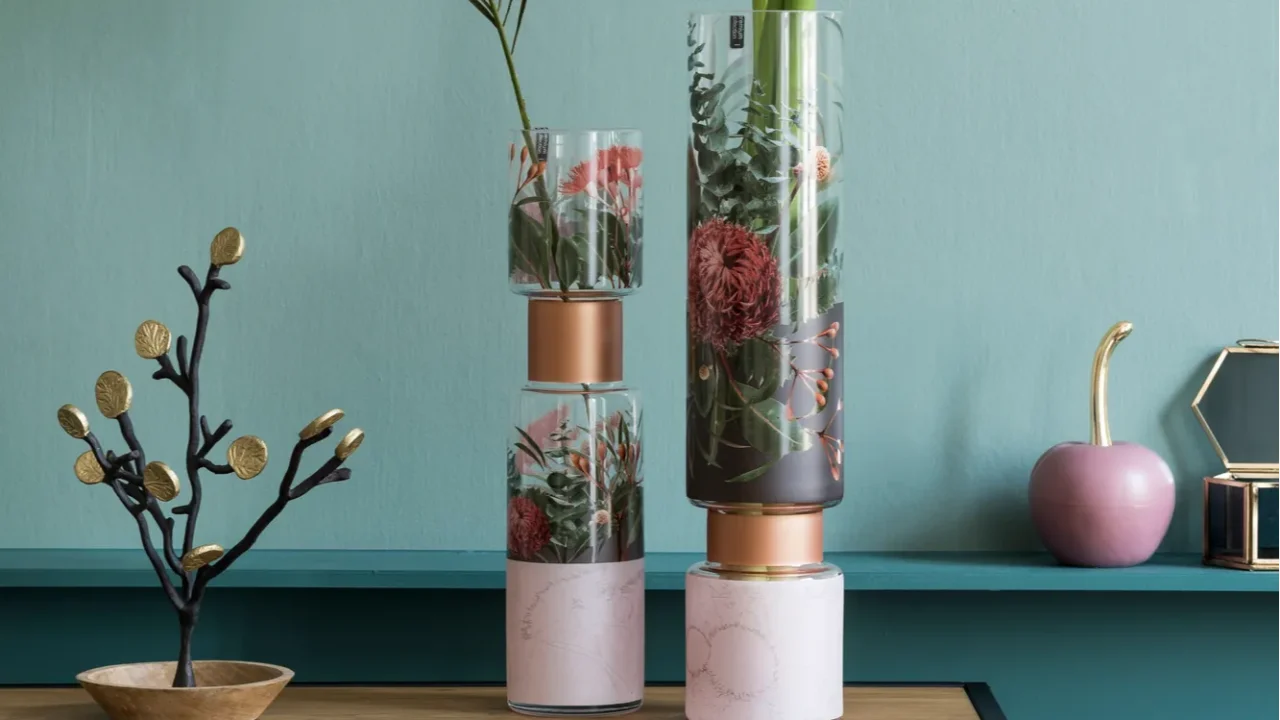 flowers in stylish vase on cabinet interior design