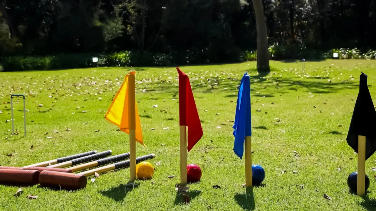 french garden croquet set with flags on a grass
