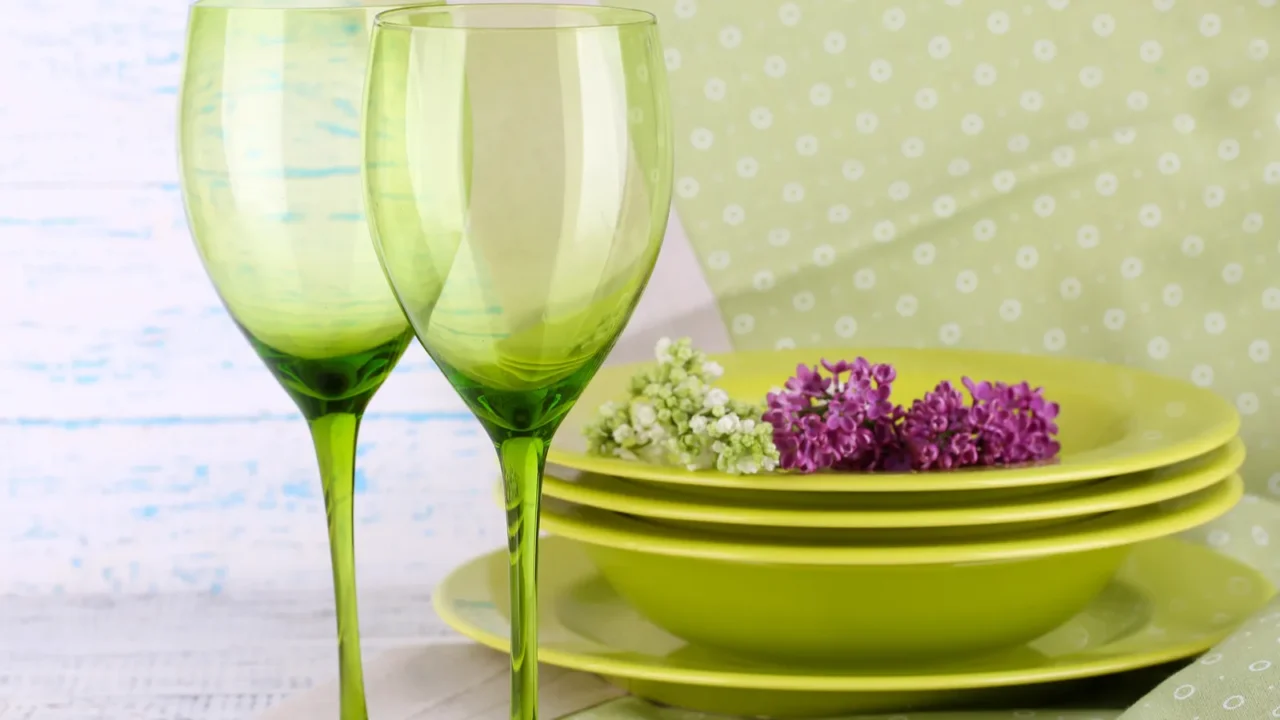 green table settings on table on light background