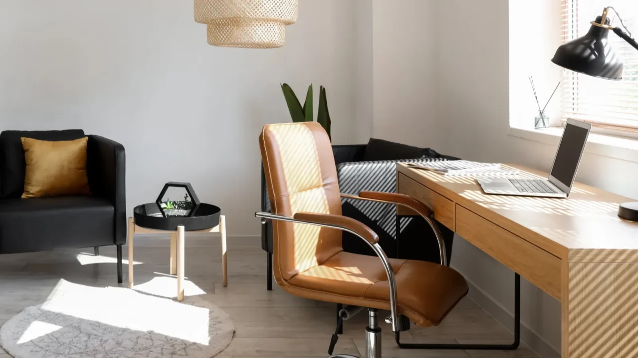 interior of modern office with workplace and black armchairs