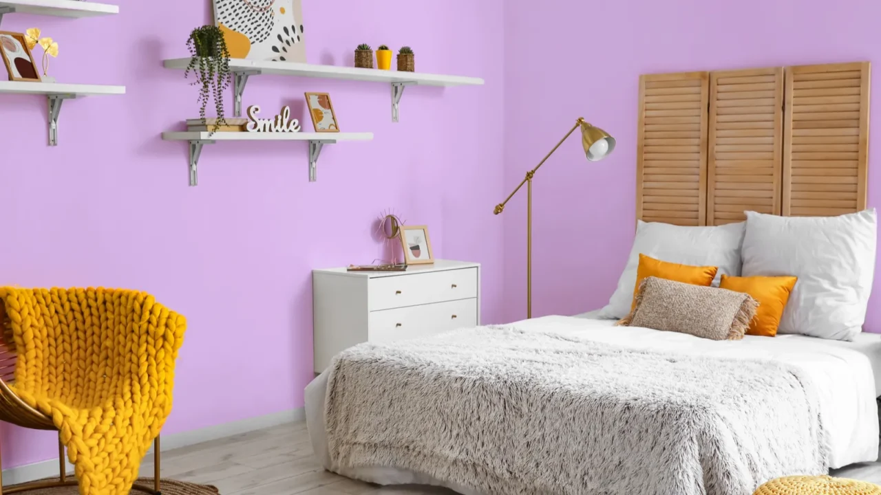 interior of stylish bedroom with golden lamps and armchair