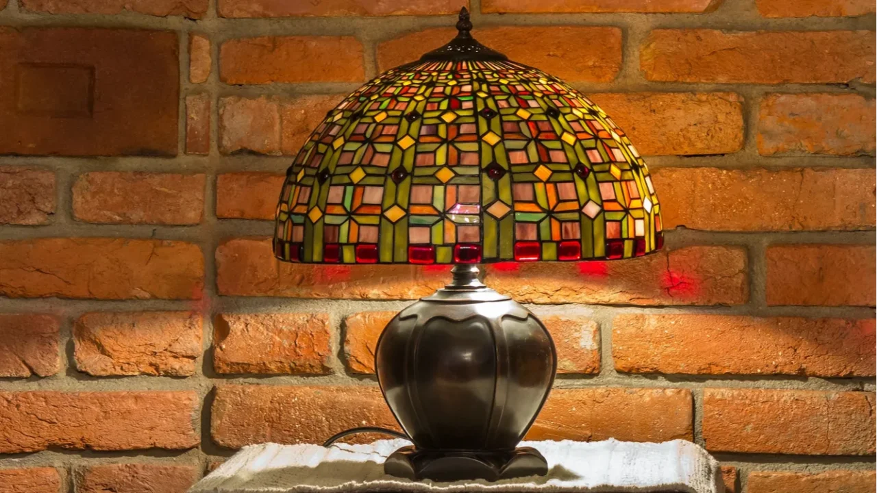 lamp of stainedglass on red brick wall