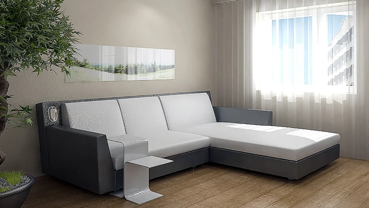 A room with cozy sofa, plant, coffee table, and art on the wall, with sunlight filtering through the sheer curtains.