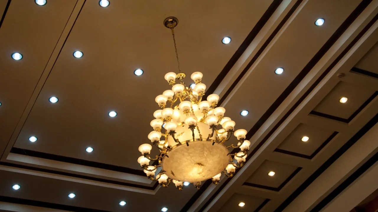 Overloading a space with recessed lights, chandeliers, wall sconces, and LED strips
