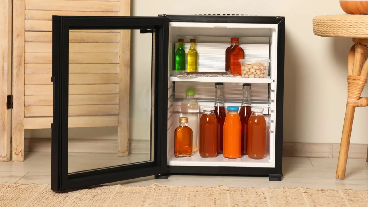 mini refrigerator with drinks and snacks indoors