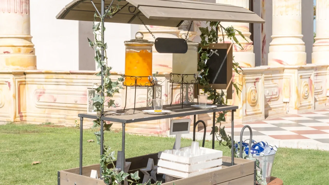 nice drink cart with lemonade and orangeade decorating a garden