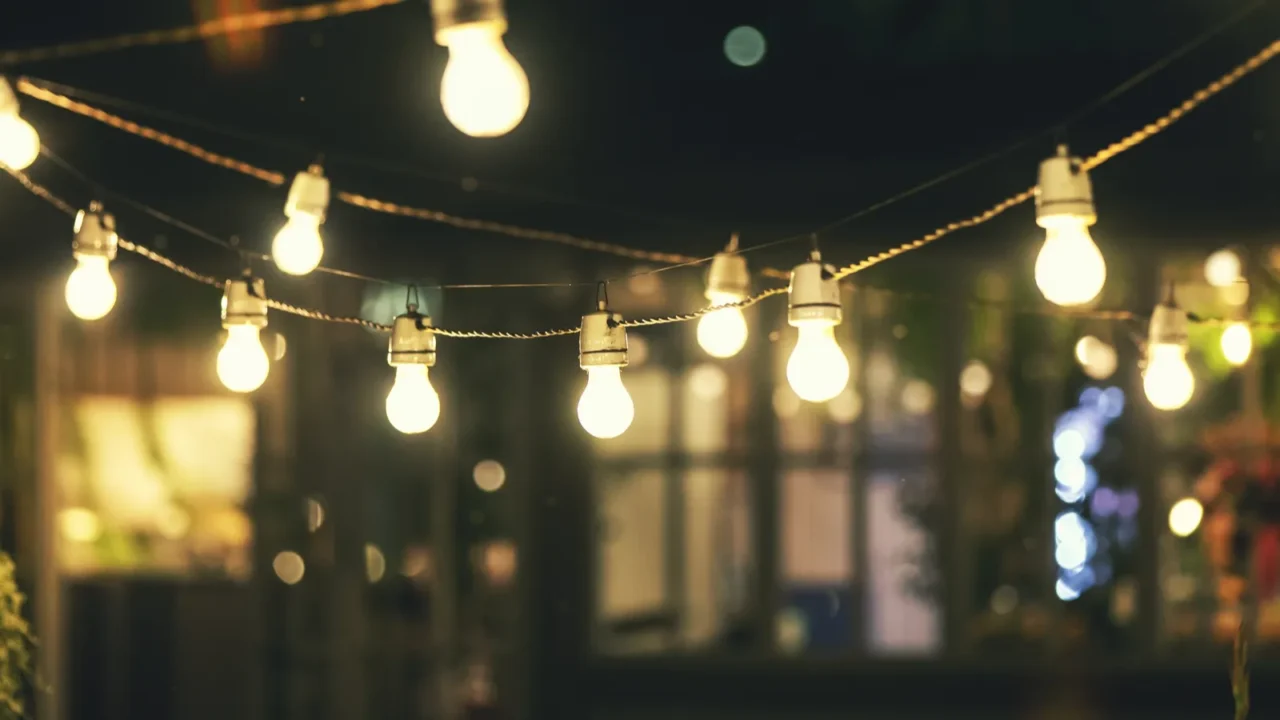 outdoor party string lights glowing at night
