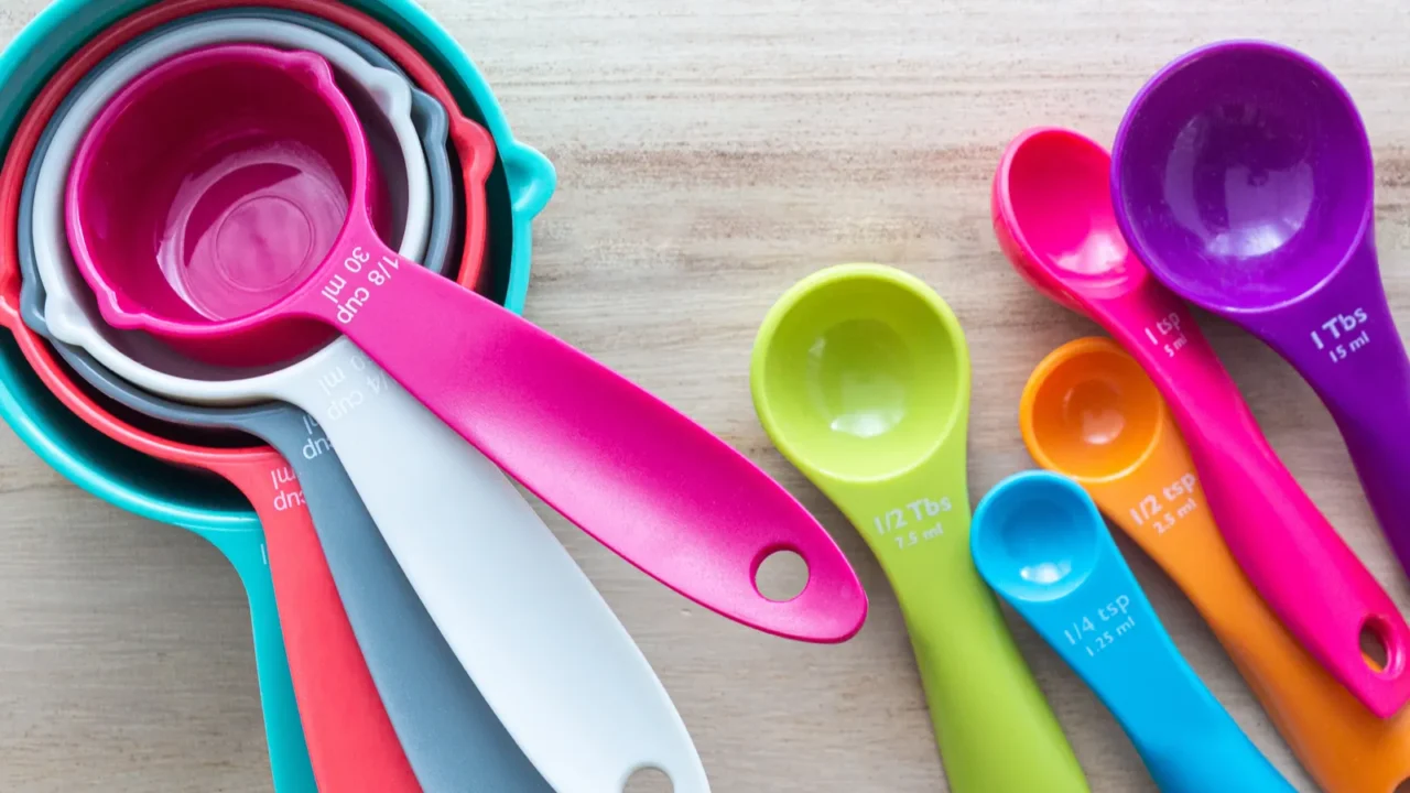 set of colorful measuring cups and measuring spoons use in