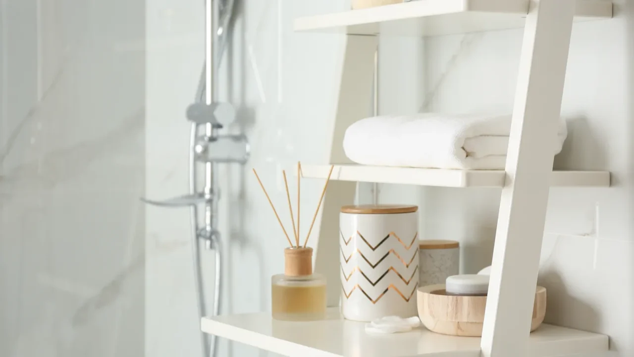 shelving unit with different items in bathroom interior