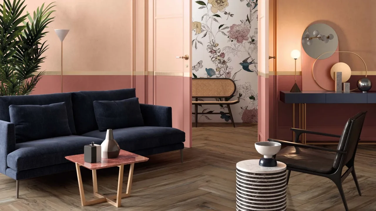 A stylish living room with a navy sofa and decorative elements.