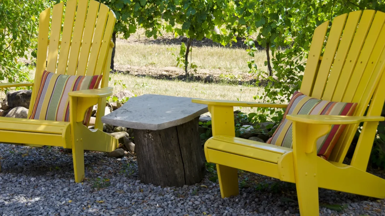 yellow adirondack chairs on a patio