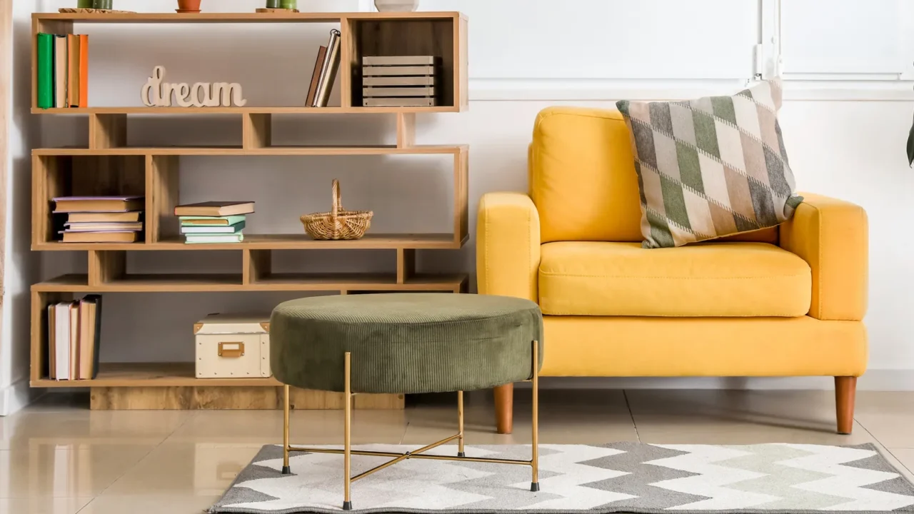interior of modern room with shelf unit and armchair