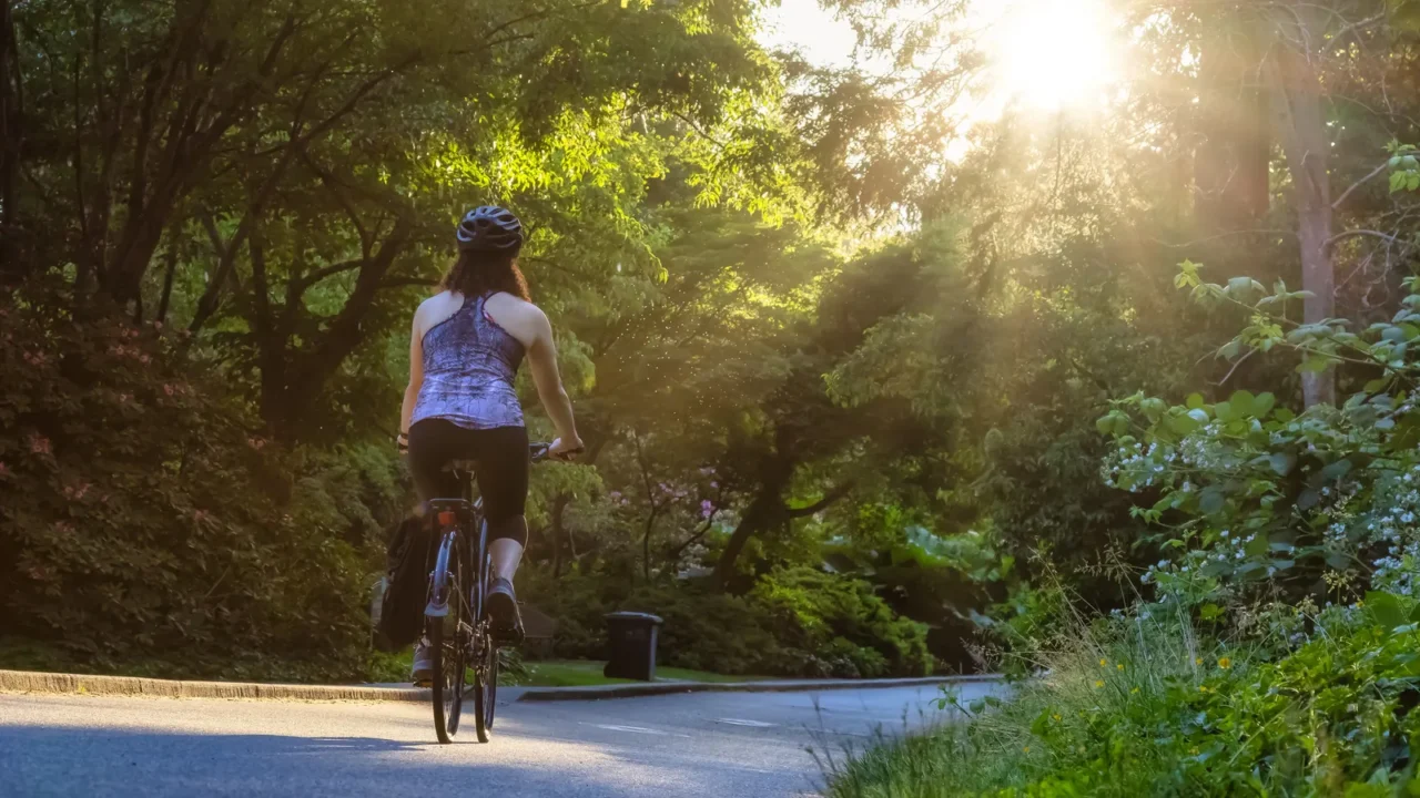 adventurous white caucasian adult woman riding a road bicycle
