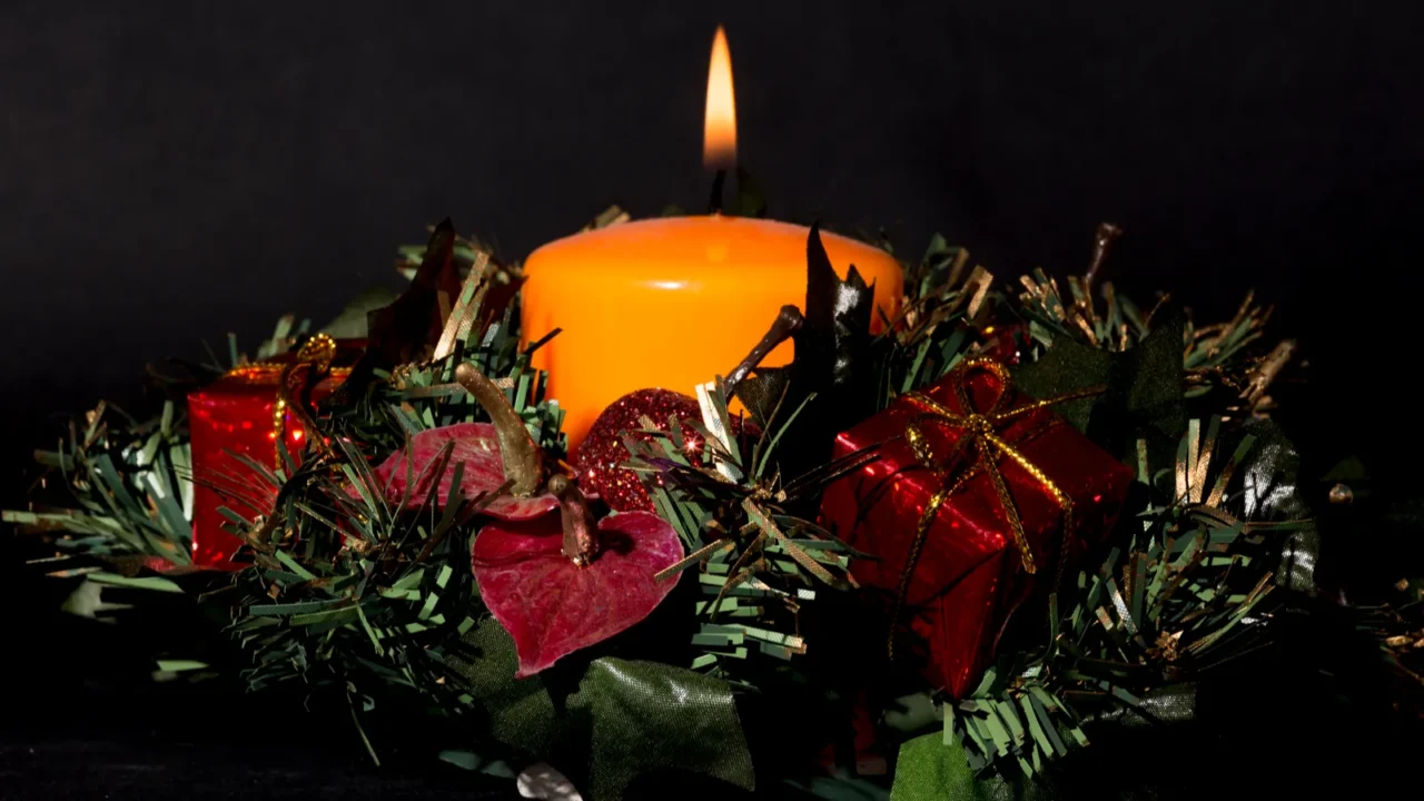 christmas centerpiece with a lit candle