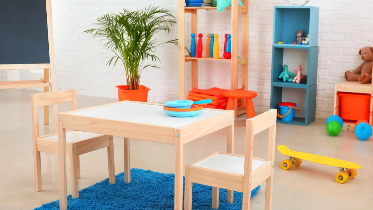 A child's playroom with a wooden table and colorful toys.