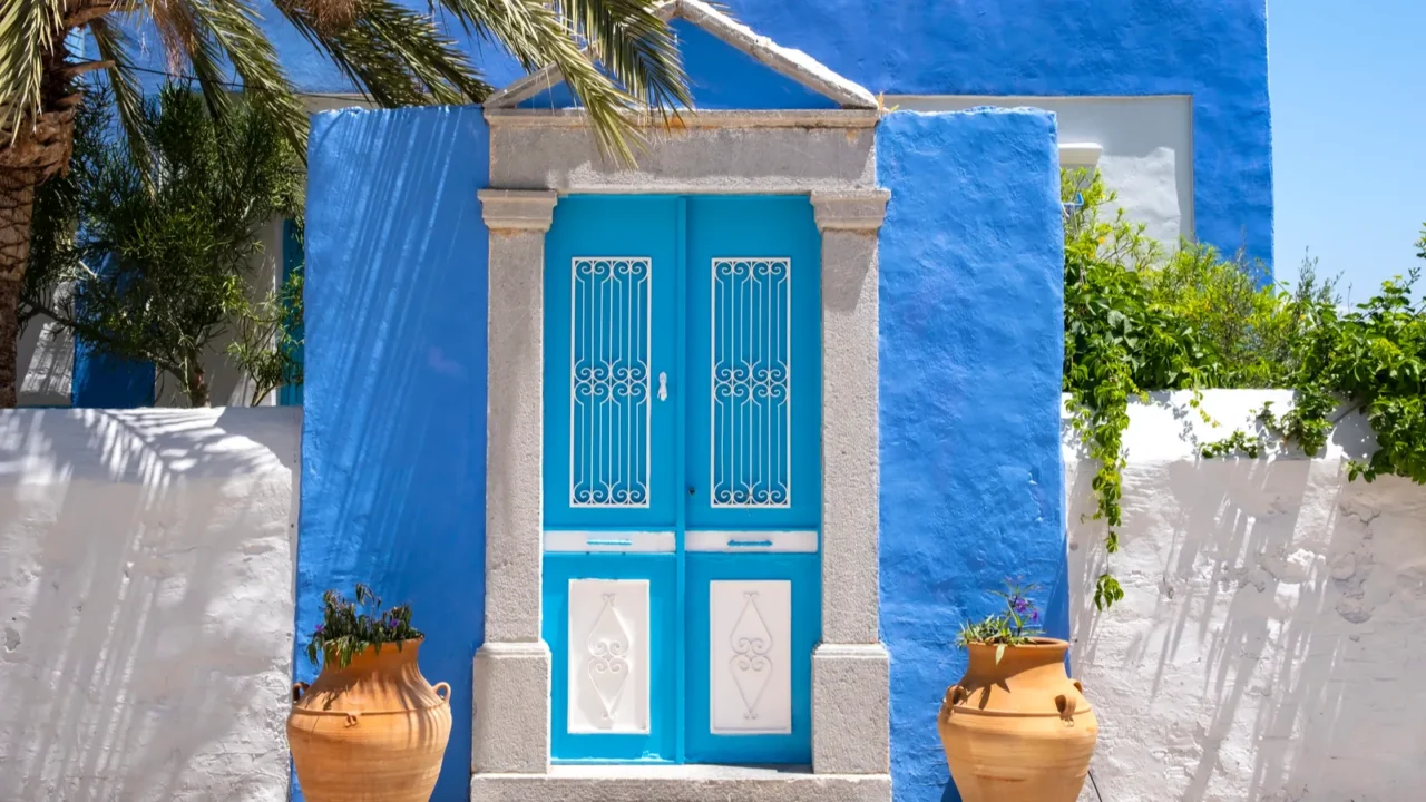 pretty blue and white facade of a small house in
